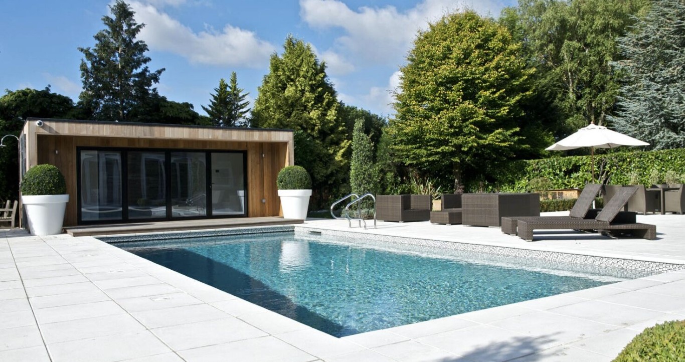 Luxury residential pool with modern pool house and professional cleaning services in Princeton, TX