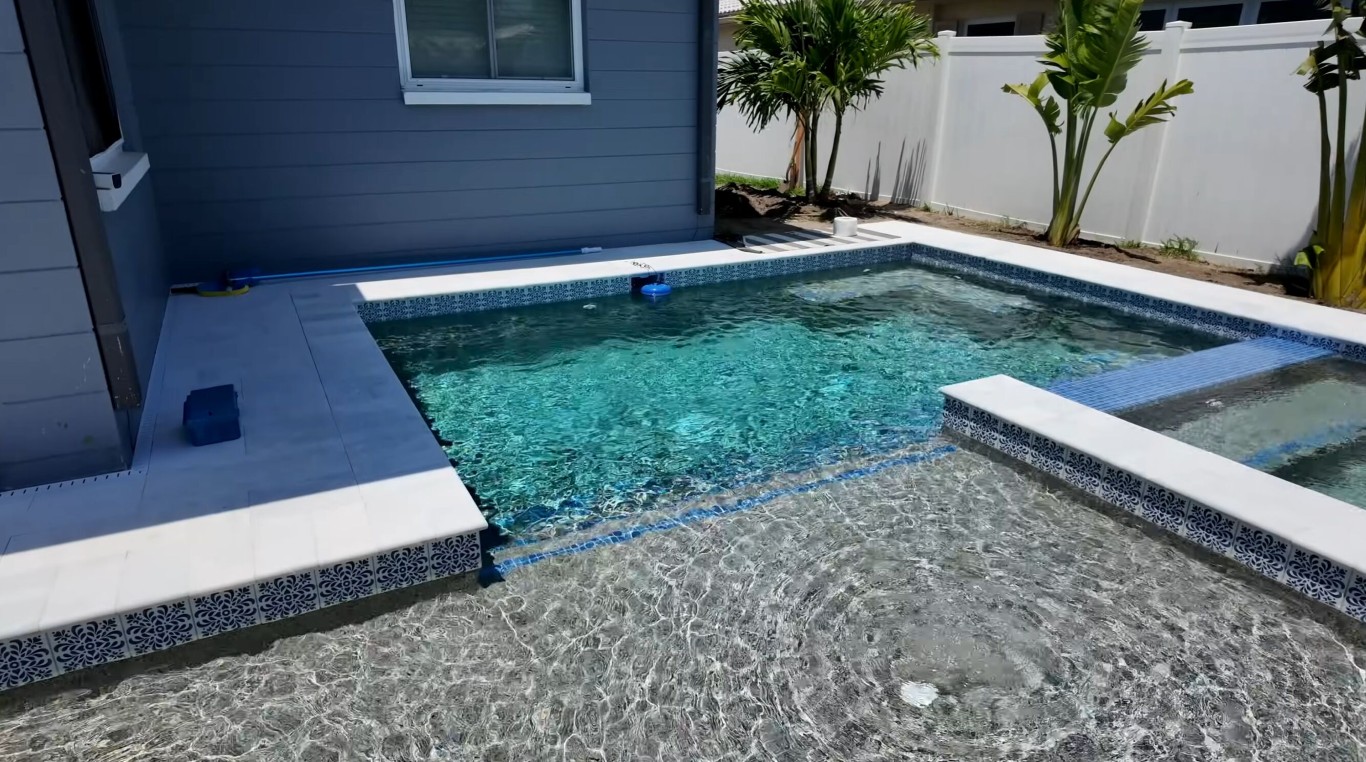 Crystal clear residential swimming pool maintained by professional pool cleaning service in Princeton, TX