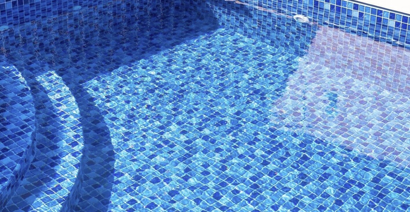 Deep pool cleaning service showing pristine blue pool tiles in Princeton, TX